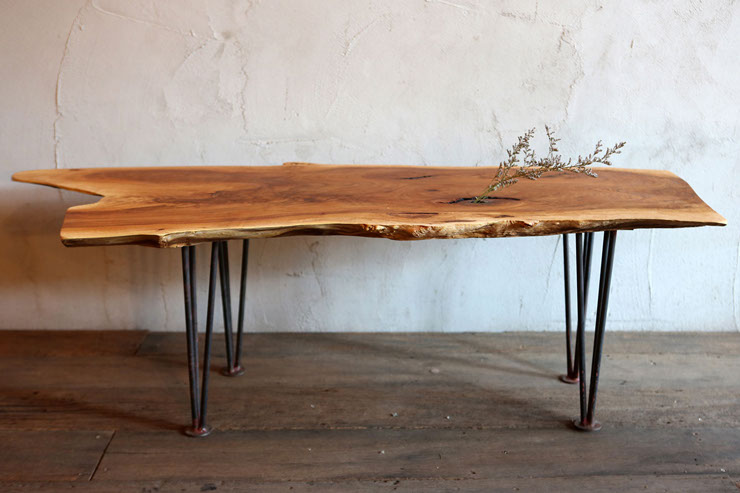 image of an informal dining table designed by vachira tongrow from his "if i were a carpenter" collection top remains with bark edges