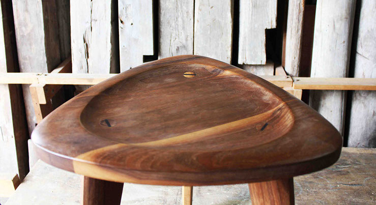 image of a beautiful hand stool with detailed wedge joins by the craftsman Nu based in bangkok, Thailand